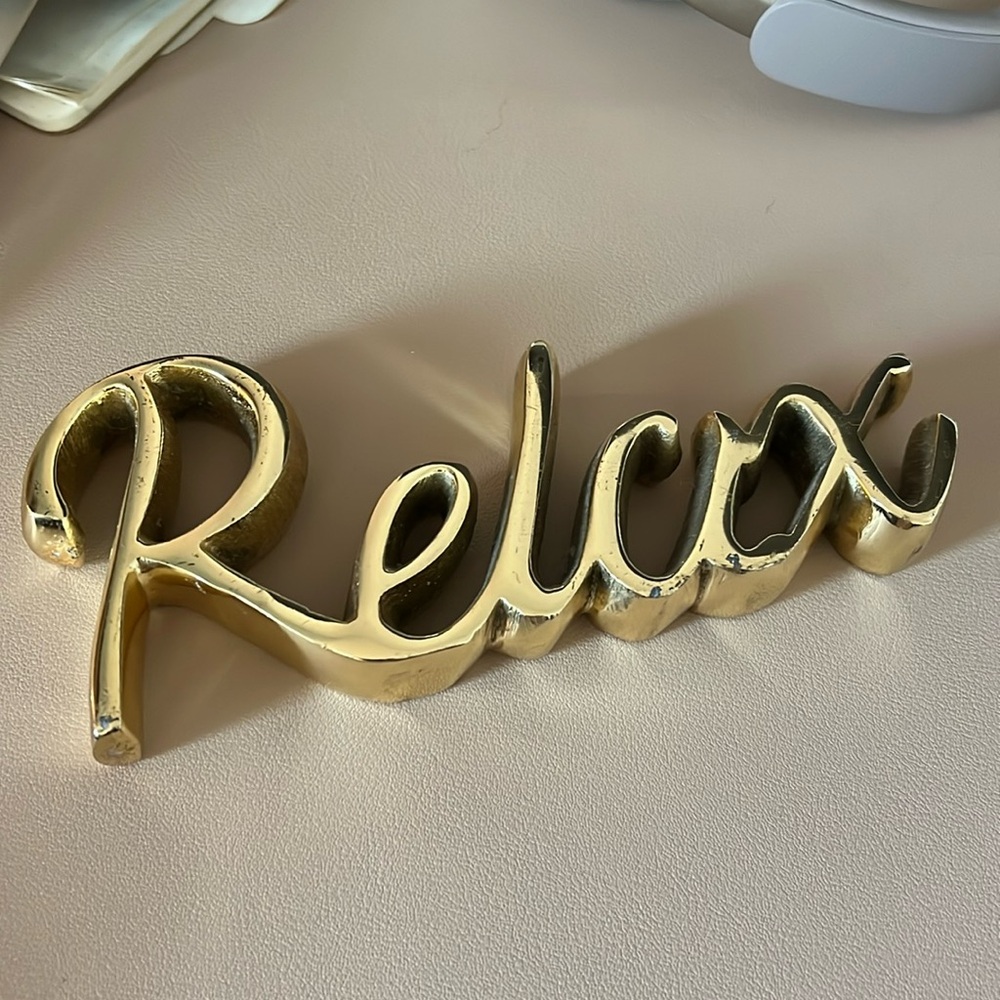Gold “Relax” sign
